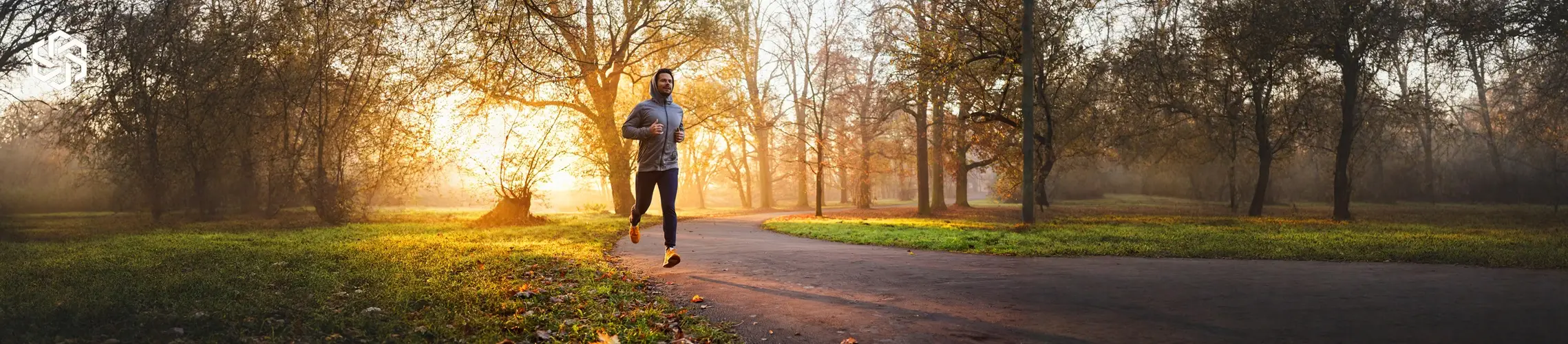 Man jogging outdoors at sunrise, representing improved energy and physical wellness from hormone optimization