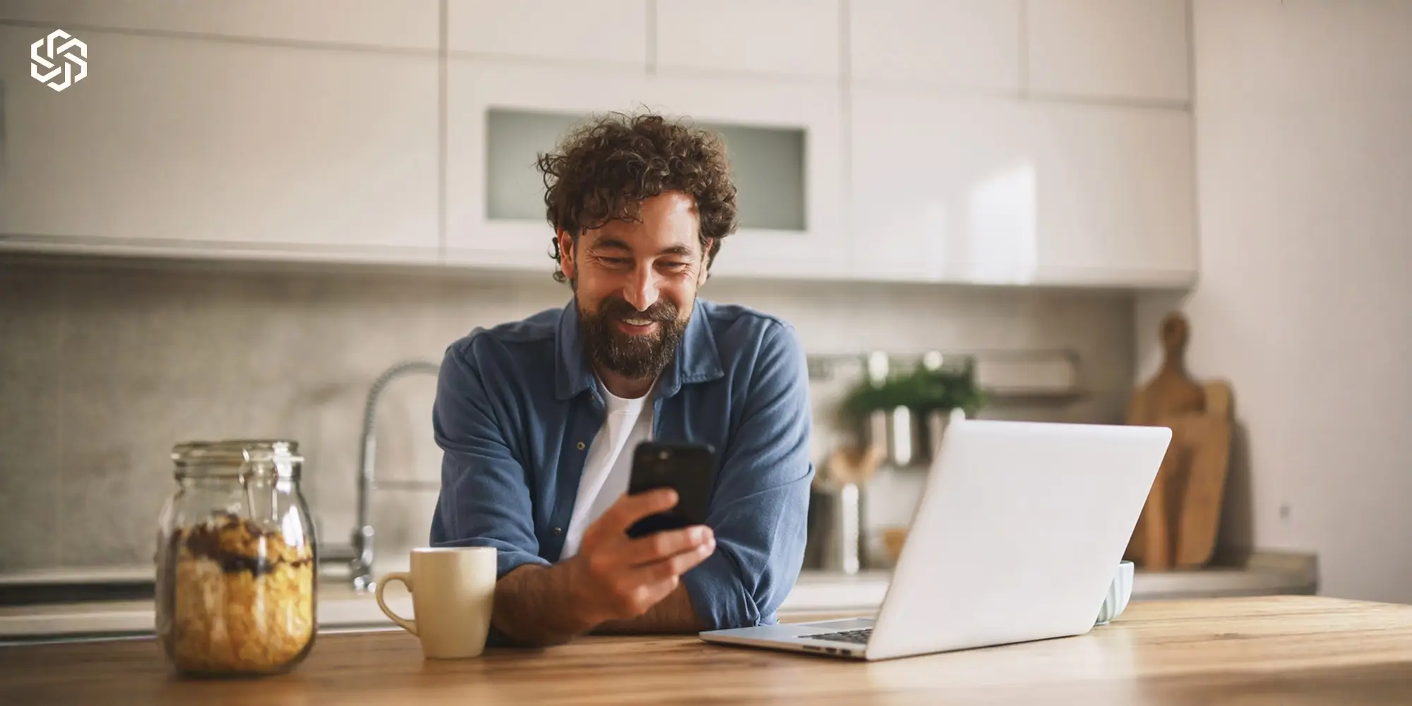 Man reviewing health information on a smartphone at home, representing long-term hormone management