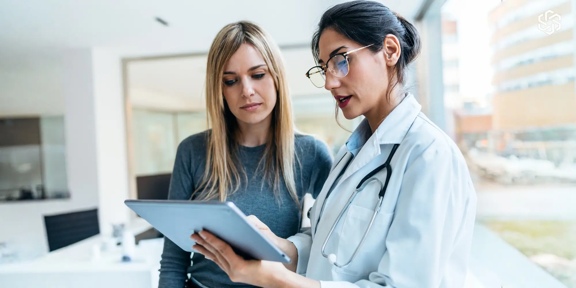 Provider reviewing hormone test results with a female patient during a consultation