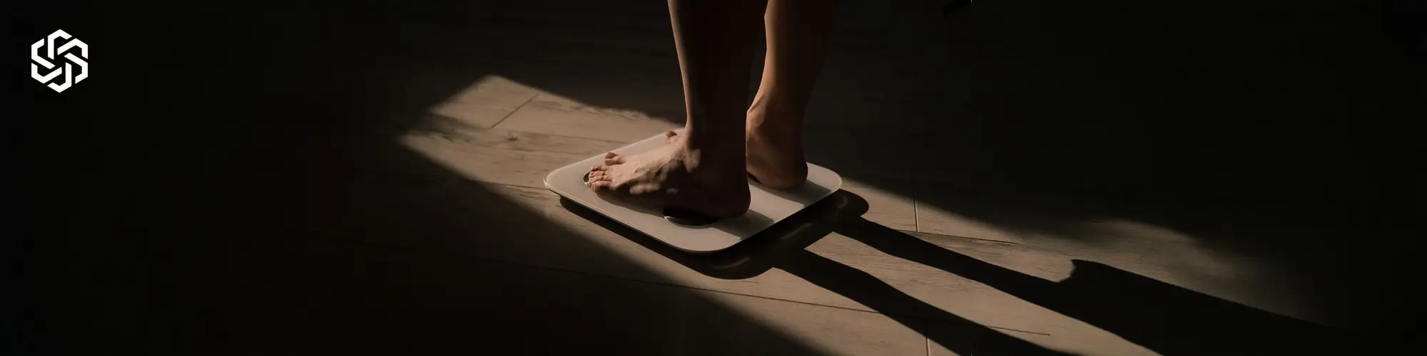 Person standing on scale representing weight loss supported by Weight Loss IV Therapy in Lake Forest