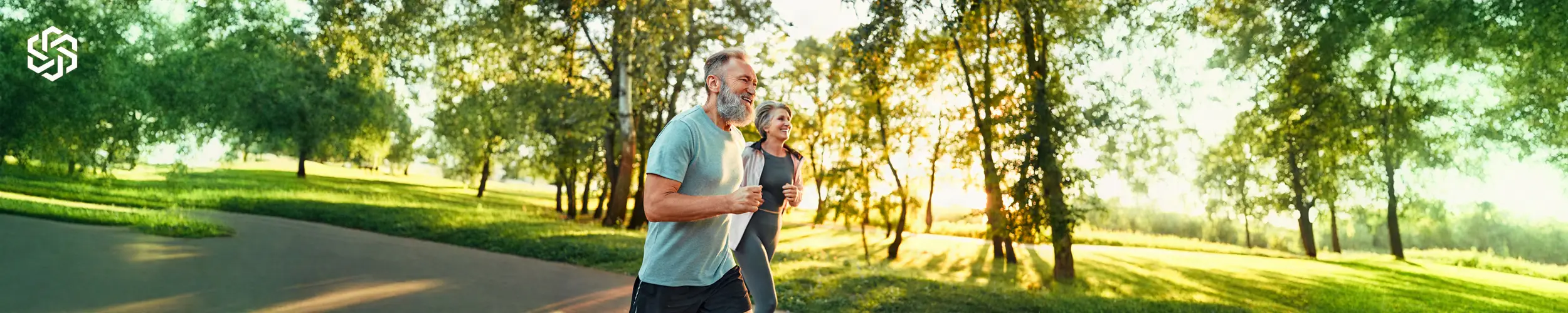 Active couple exercising outdoors representing medical weight loss and metabolic wellness.