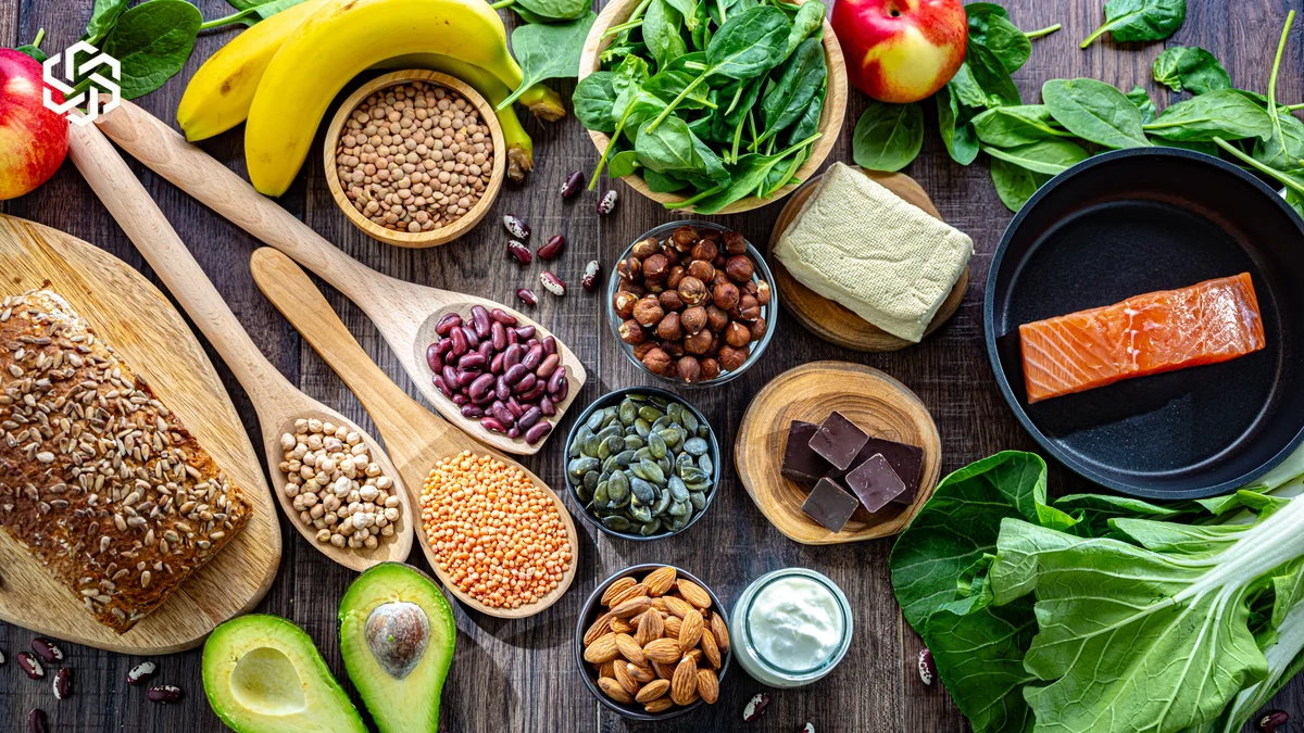 Magnesium-rich foods including leafy greens, nuts, seeds, beans, whole grains and salmon