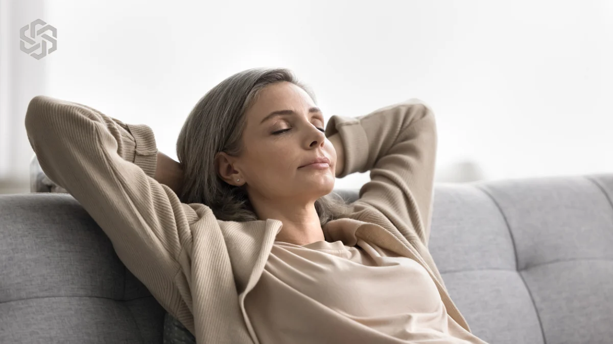 Woman relaxing on the sofa with her eyes closed