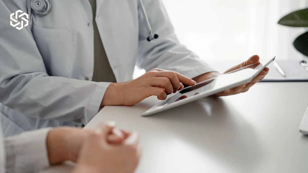 Provider reviewing a tablet with a patient