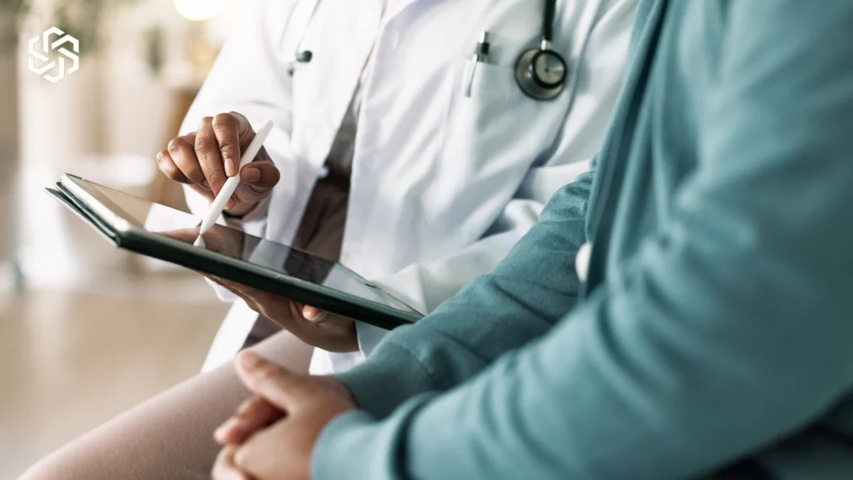 Provider reviewing a tablet with a patient