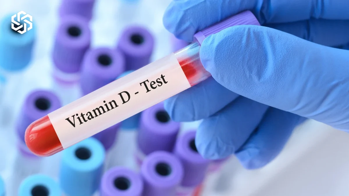 Gloved hand holding a vitamin D blood test tube