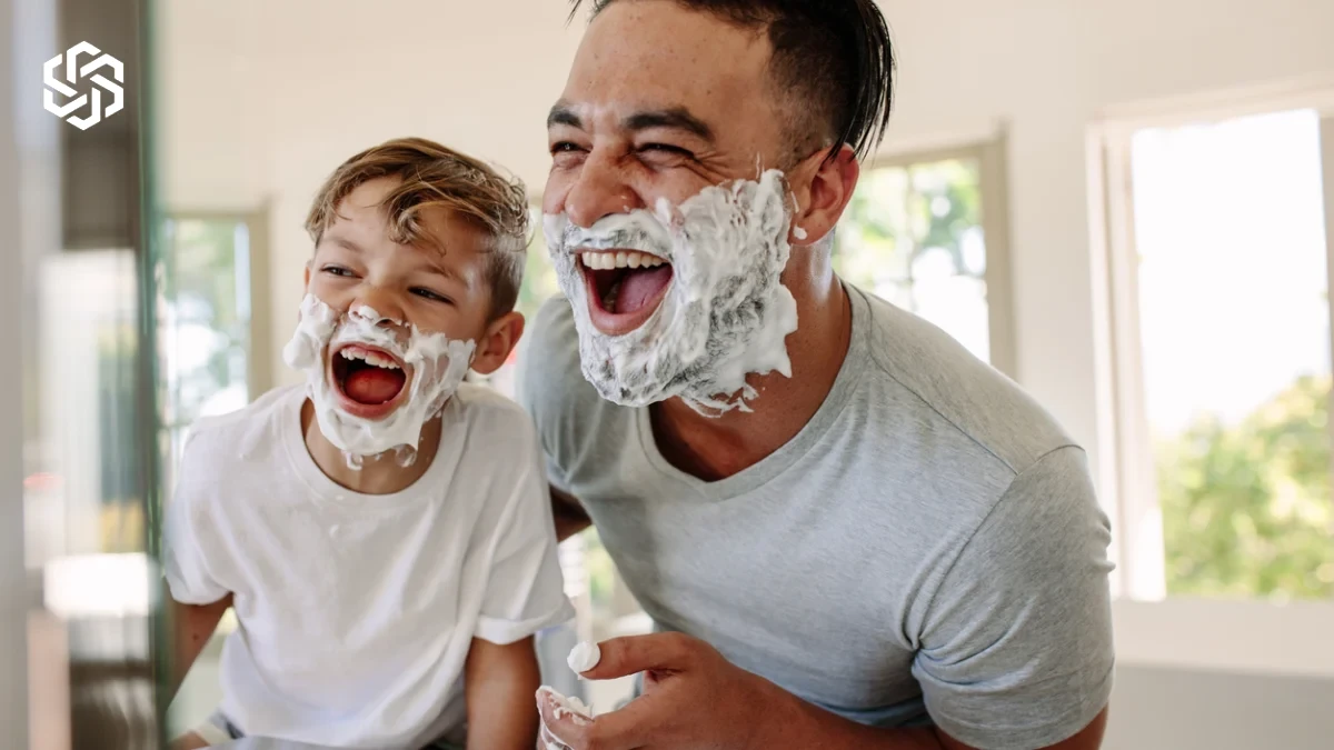 Father and son shaving together