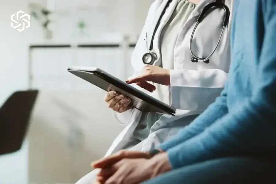 Provider and patient reviewing a tablet