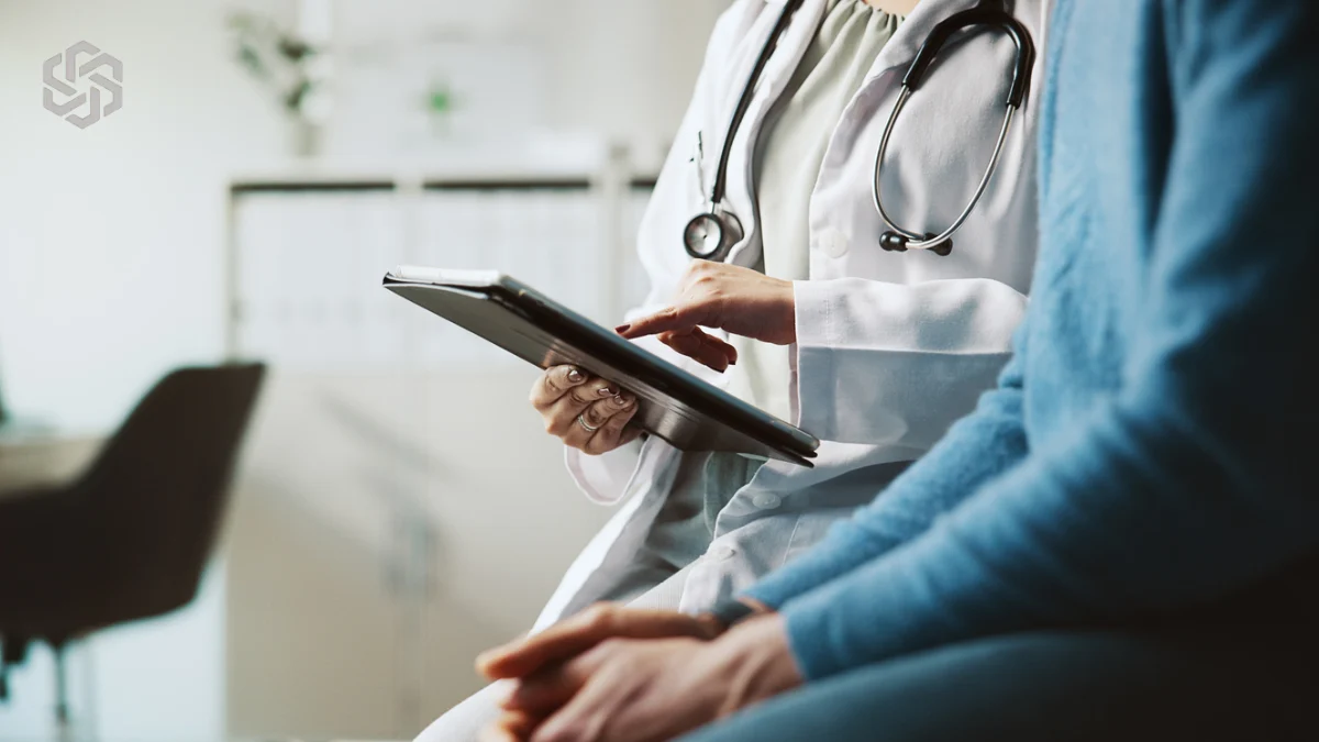 Provider and patient reviewing a tablet