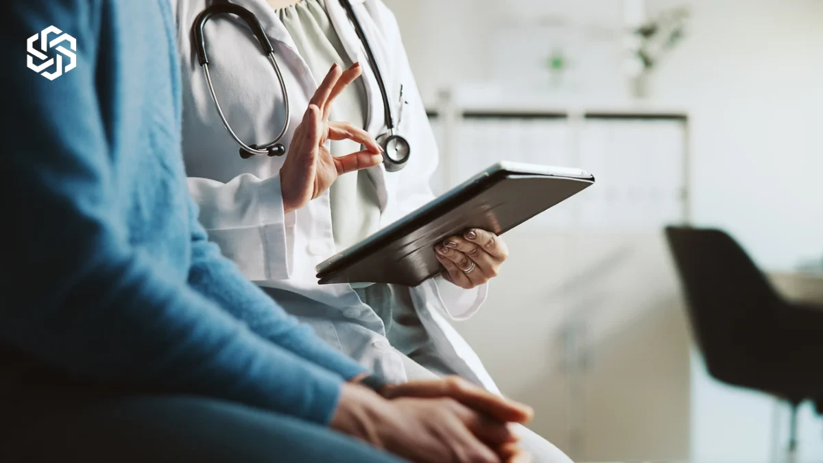 Provider explaining thyroid panel results to a patient on a tablet