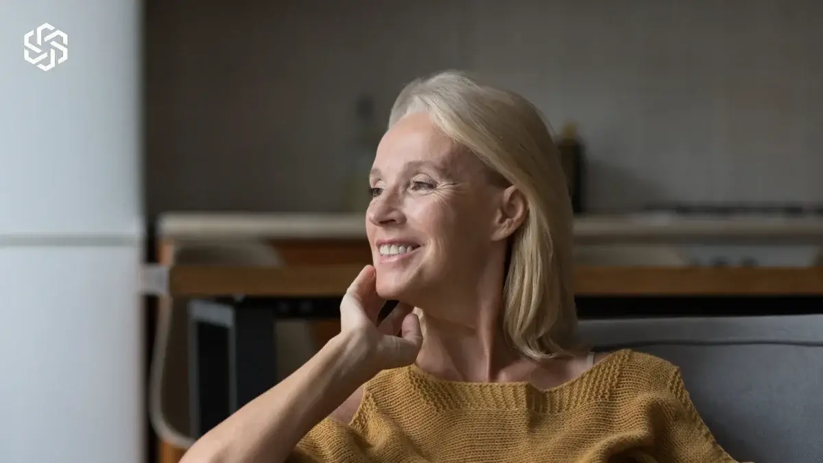 Smiling mature woman relaxing at home