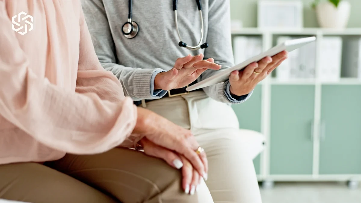 Provider reviewing a tablet with a patient