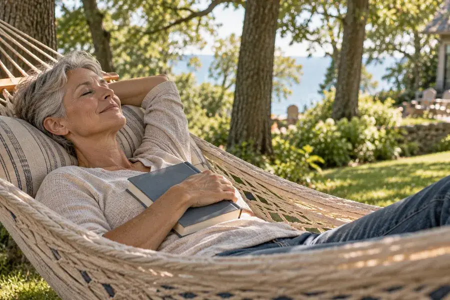 Woman relaxing in a hammock under oak trees