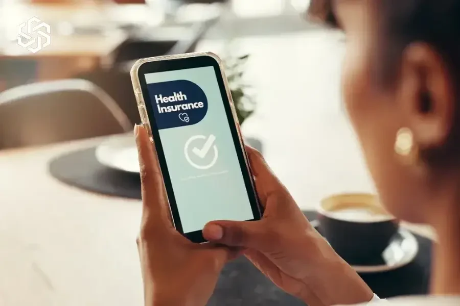 Person checking health insurance approval on a phone