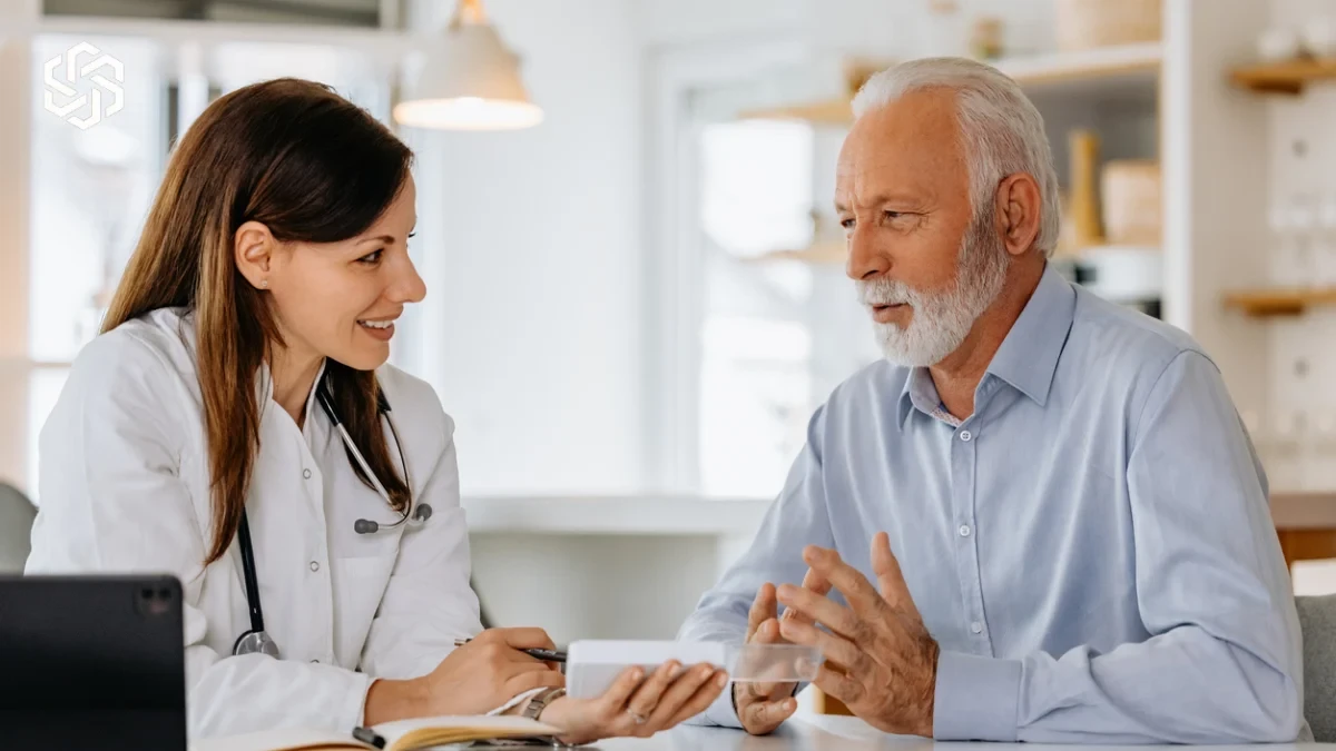 Provider talking with an older male patient