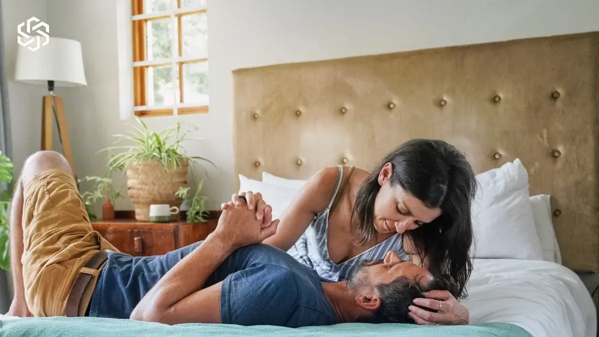 Couple relaxing together on a bed at home