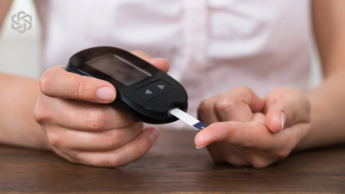Person checking blood sugar with a glucometer
