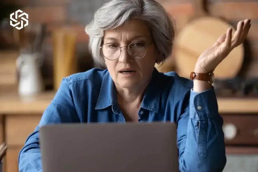Confused woman looking at a computer screen