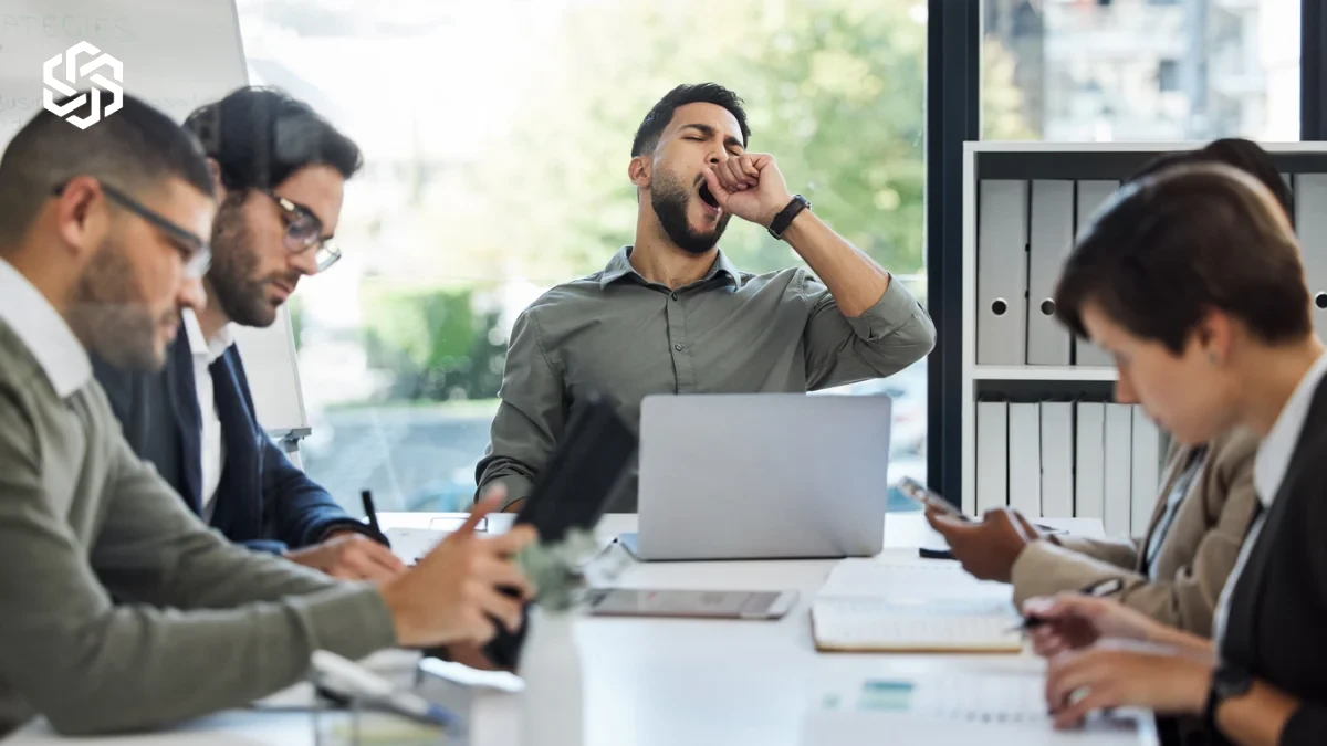 Man yawning during a work meeting