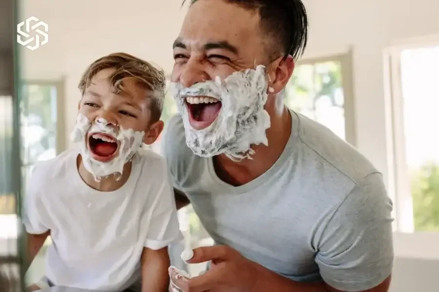 Father and son shaving together