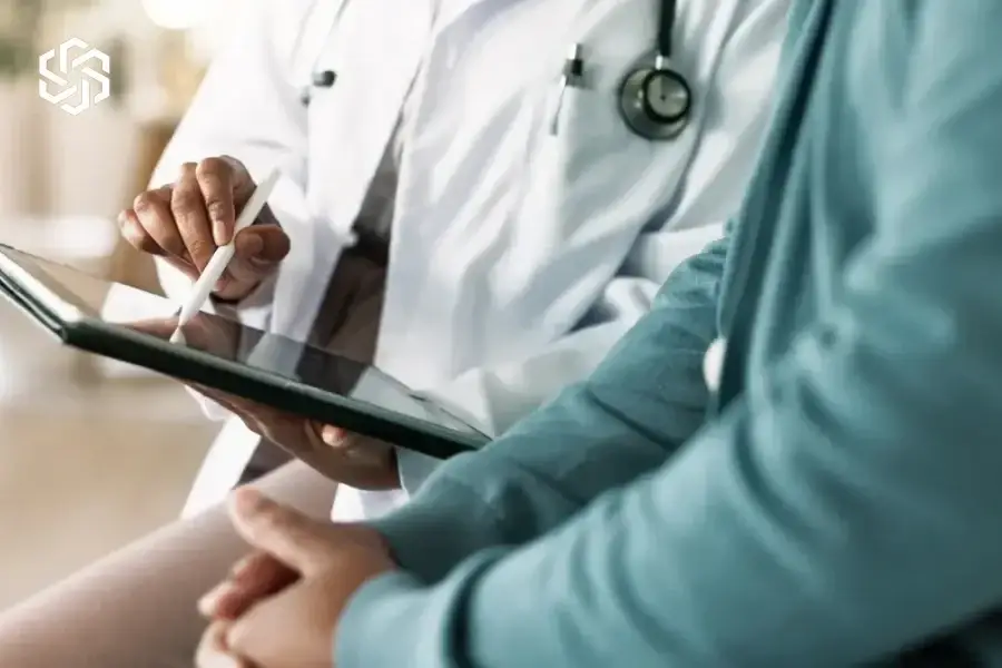 Provider reviewing a tablet with a patient