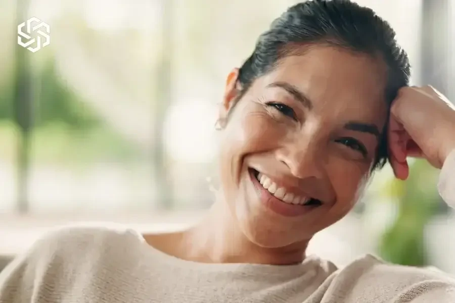 Smiling woman relaxing at home