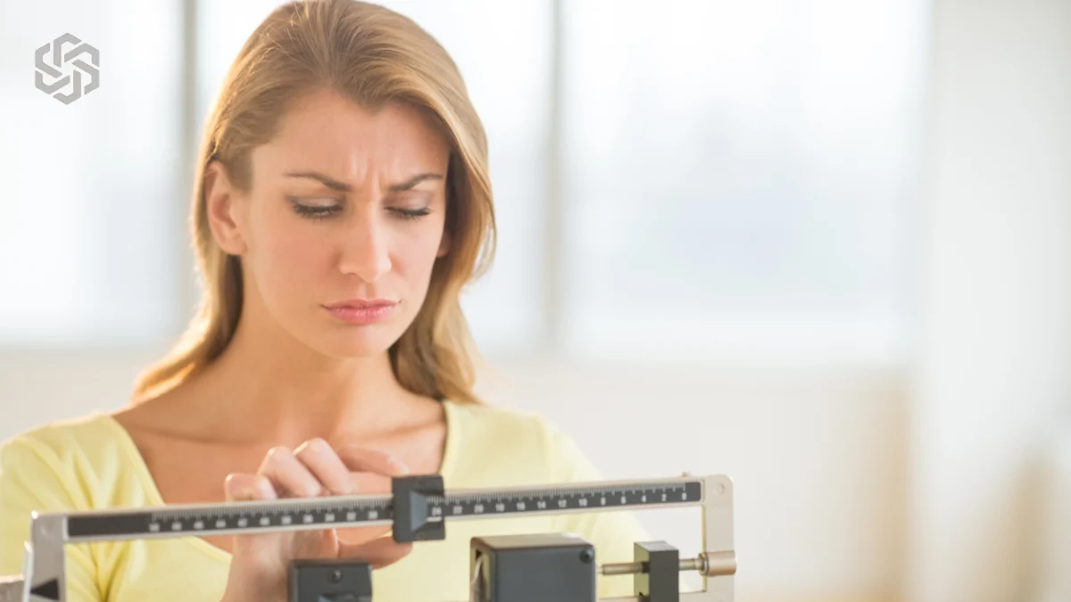 Woman adjusting a balance scale, illustrating a GLP-1 plateau