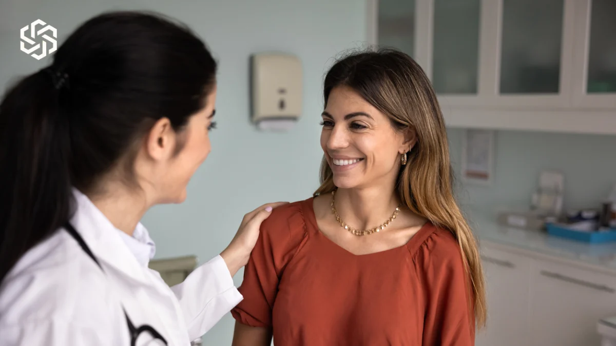 Provider reassuring a smiling patient